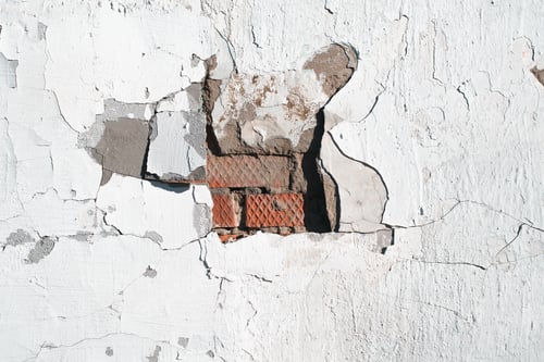 Preview: Destroyed stucco brick wall in middle, uneven textured gray surface with cracks and scuffs
