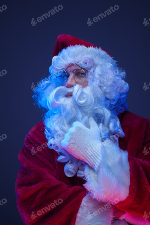 Preview: Bearded elderly santa claus with red costume and beard