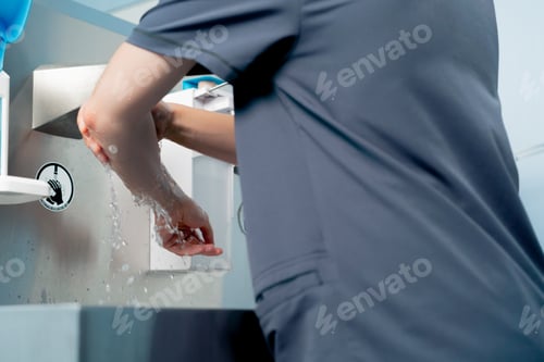 Preview: close up in a modern clinic in a bright, spacious preoperative area for sterilization of the surgeon
