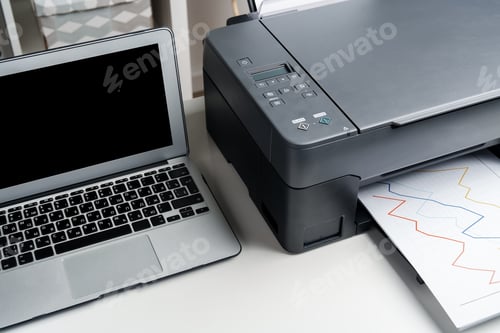 Preview: New modern printer and laptop in the office on table