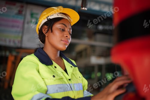 Preview: Robotics engineer working on maintenance of robotic arm in factory warehouse. Business technology.