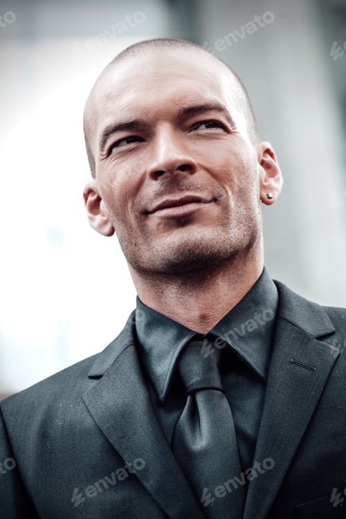 Preview: Portrait of face youth businessman on gray monochrome background outdoor office building in the day