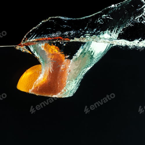 Preview: Orange falls into the water and making splashes