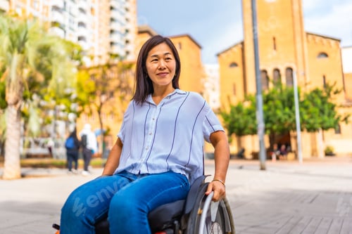 Preview: Asian woman with disability using wheelchair in the city