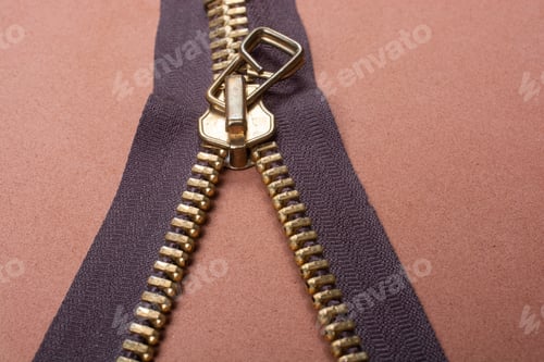Preview: Closeup shot of a zipper on a brown surface