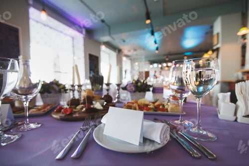 Preview: Dining table setting at Provence style, with candles, lavender, vintage crockery and cutlery.