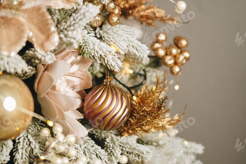 Preview: Beautiful Christmas tree with golden balls decor close up