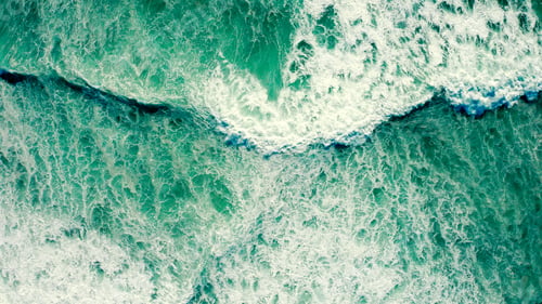 Preview: Drone view over ocean waves , on summer sunny day. Top view to the beautiful green Atlantic Ocean.