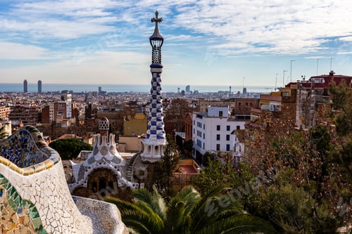 Preview: Aerial view of Barcelona cityscape and church tower with blue cloudy sky in Spain