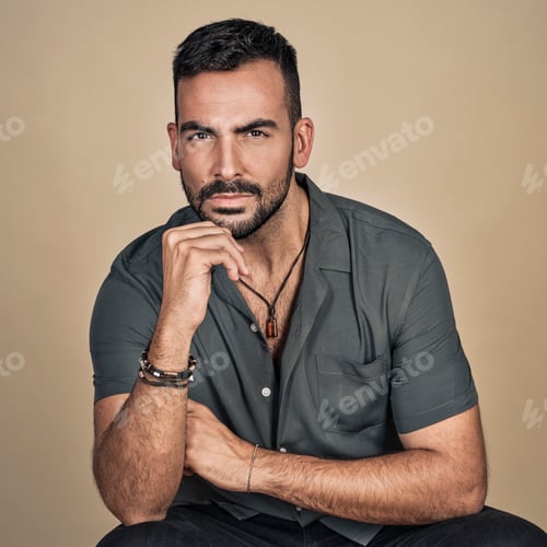 Preview: Portrait of an attractive bearded young man from Spain in an elegant gray shirt