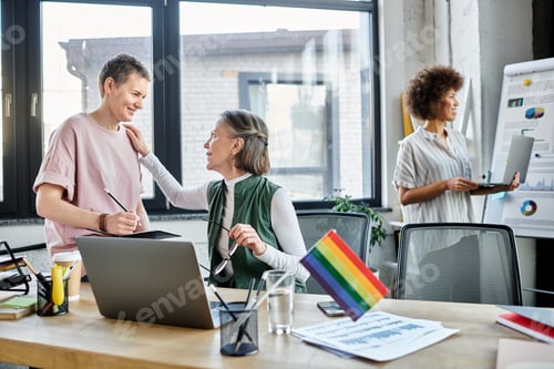 Preview: Collaborative Innovation: Woman Engages With Man at Computer