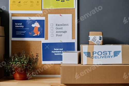 Preview: Stack of packed boxes with clothes and noticeboard with information