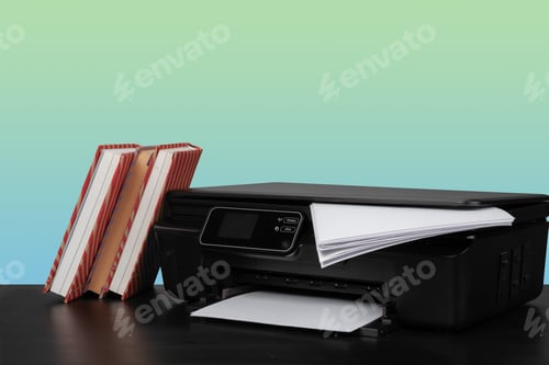 Preview: Home laser printer on desk against green background