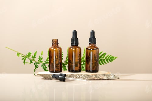 Preview: Amber glass transparent bottles on wooden podium