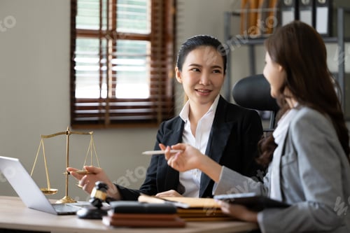 Preview: Lawyer office. Statue of Justice with scales and lawyer working on a laptop. Legal law, advice and j