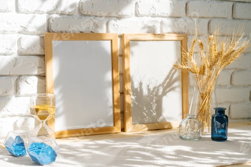 Preview: Photo frames on a brick wall background on the table with wheat ears in vase
