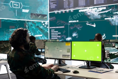 Preview: Professional IT engineer looks at surveillance footage and isolated mockup