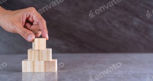 Preview: hand stack woods block step on table. business development concept.copy space.