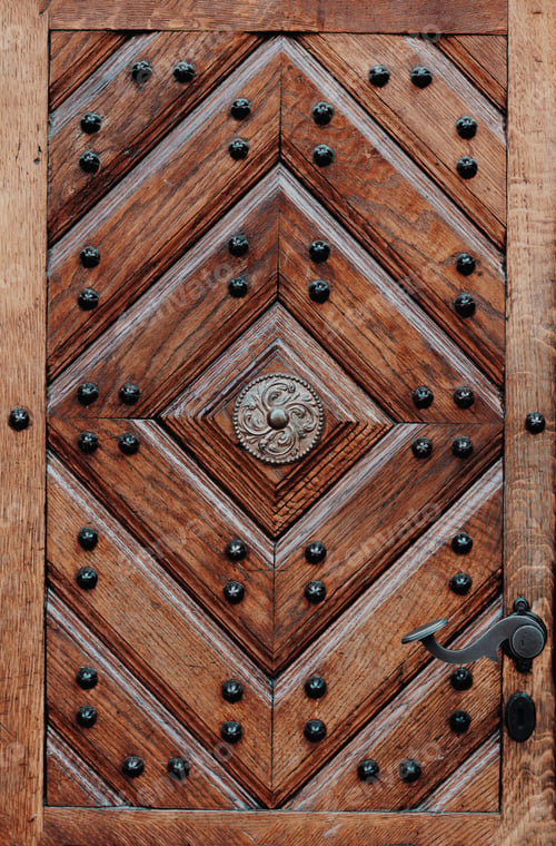 Preview: Ancient wooden door with forged metal handle