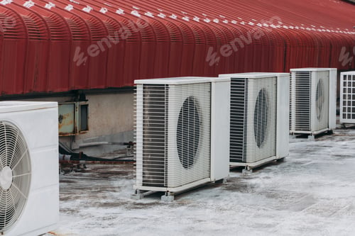Preview: Air conditioner compressor is set up on the roof, along with big cooling units and air vents.