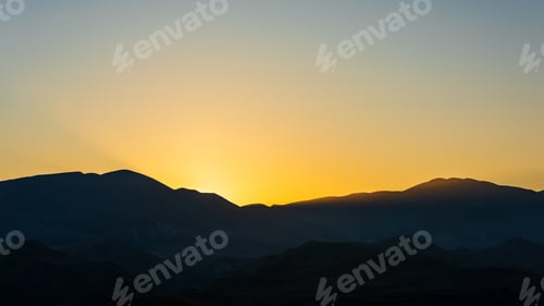Preview: Silhouetted mountain range after sunset