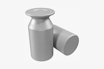 Cylindrical object with textured top and accompanying round form