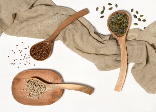 Preview: Various Seeds on Spoons on White Background