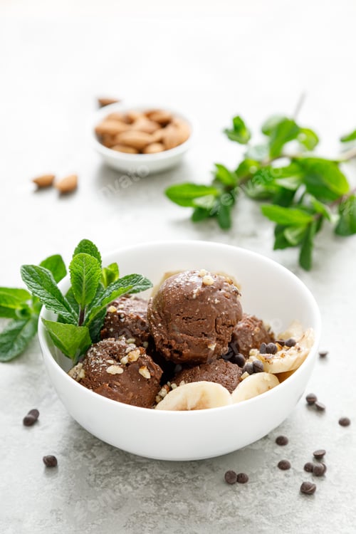 Preview: Chocolate and banana fruit ice cream with almond nuts served in bowls