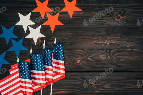Preview: top view of arranged american flags and stars on wooden surface, presidents day celebration concept