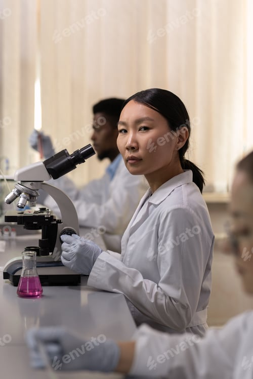 Preview: Scientist with microscope in the lab
