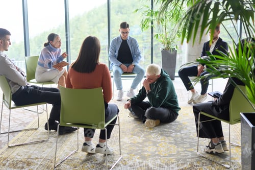 Preview: Corporate business team meeting with a manager or coach. Group of happy diverse, multiracial people