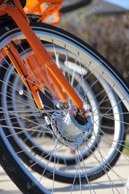 Preview: Closeup Depth of Field View of Bicycles Wheels in a Row