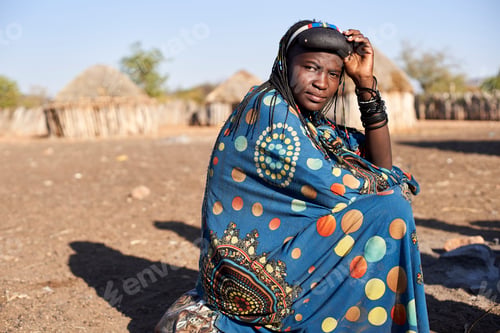 Preview: Portrait of a Muhacaona woman in her traditional colorful dress, Oncocua, Angola