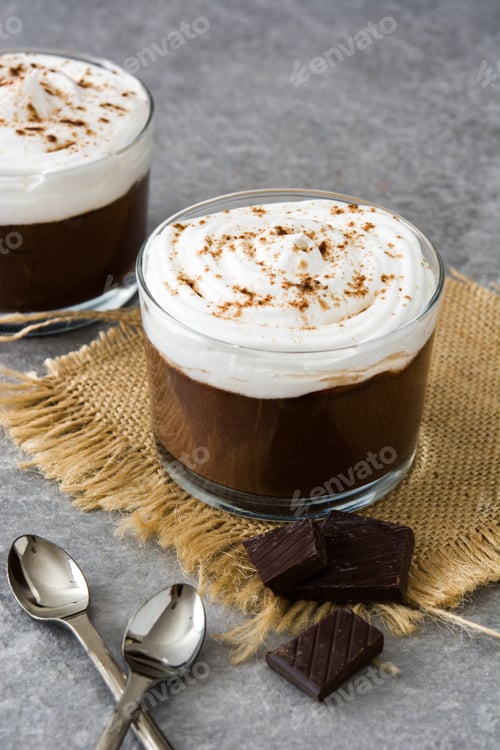 Preview: Delicious chocolate mousse cups topped with whipped cream and cocoa powder