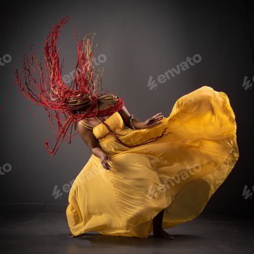 Preview: African American female wearing a bright yellow dress with her long red hair blowing in the wind