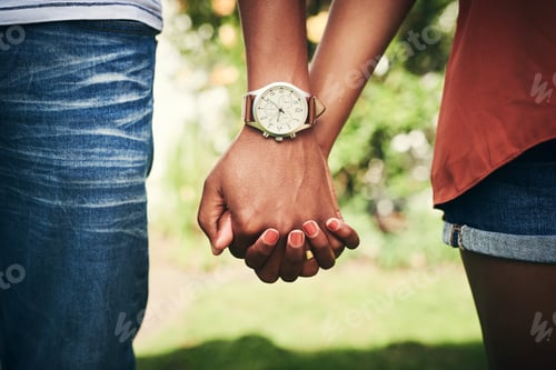 Preview: Cropped shot of an unrecognizable couple standing hand in hand outside
