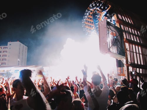 Preview: Enthusiastic Crowd Enjoying the Music at Night