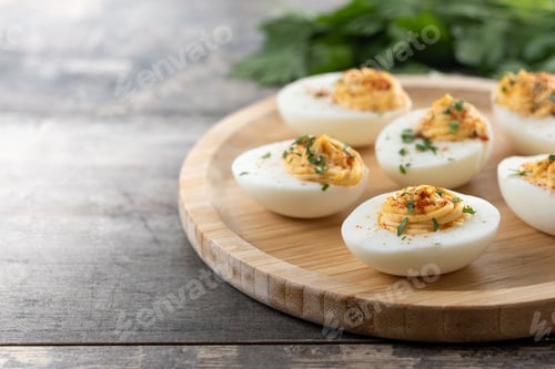 Preview: Homemade hard Boiled Deviled Eggs garnished with herbs