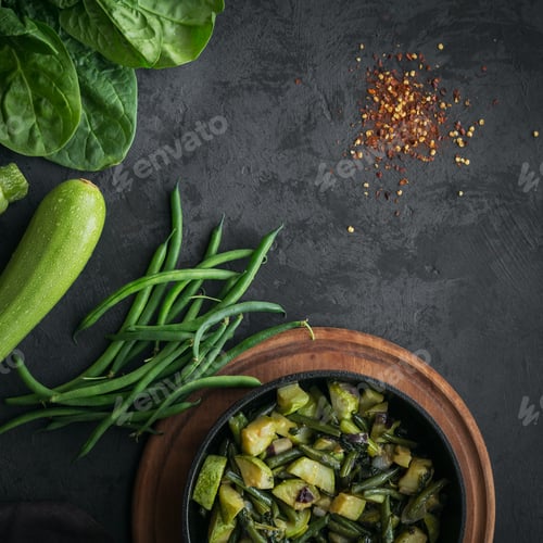 Preview: Healthy breakfast table with fried vegetables in pan and ingredient for cooking