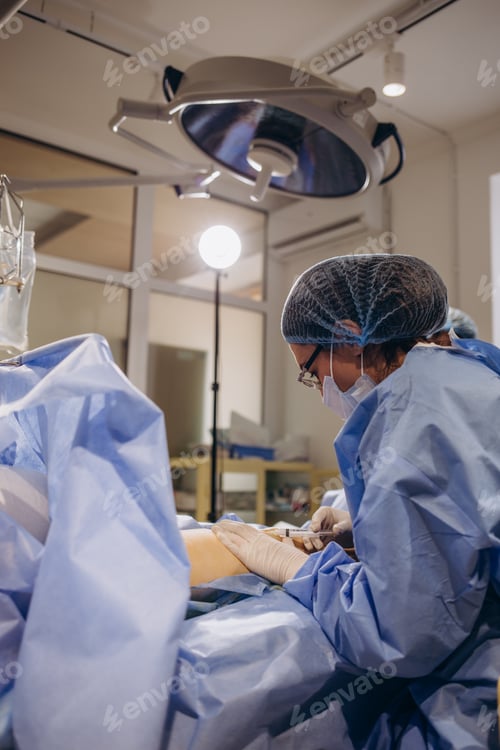 Preview: Female Surgeon Preparing Patient in Operating Room