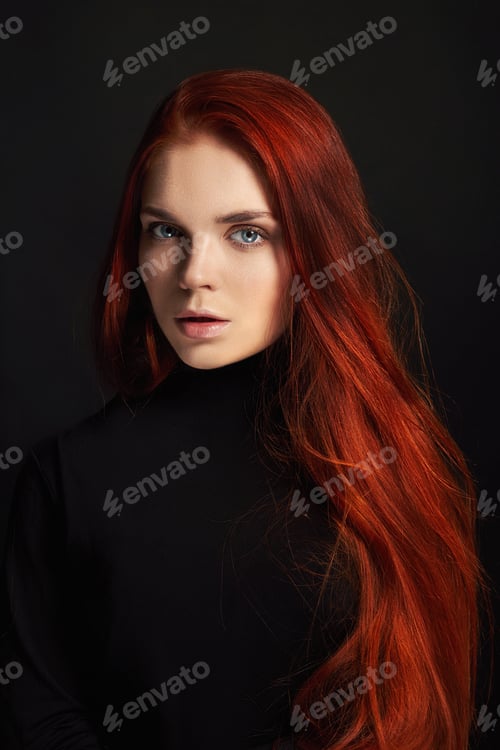 Preview: Sexy beautiful redhead girl with long hair. Perfect woman portrait on black background. Gorgeous