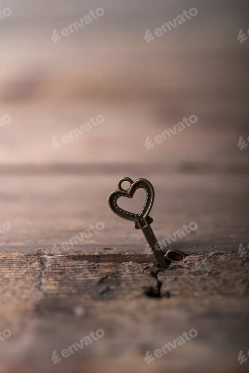 Preview: Key with two hearts as a symbol of love on the yelow background. Key of my heart concept. love valen
