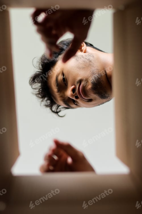 Preview: Curious Male Peering Down Into Package Seen From An Intriguing Inside Perspective