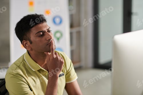 Preview: Pensive Designer Looking at Monitor