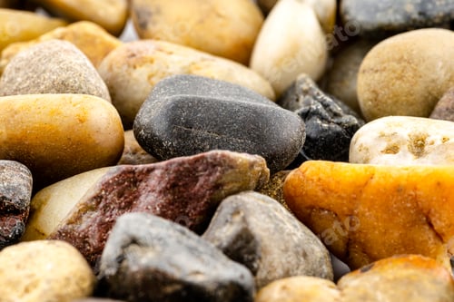 Preview: A macro shot of decorative colored pebbles, shallow depth of field, for use on a background.