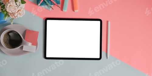 Preview: The top view image of two tones table is surrounding by a white screen tablet and equipment.