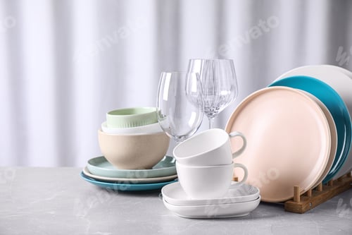 Preview: Set of clean dishware on marble table