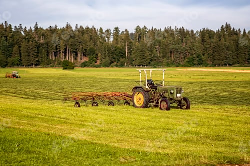 Preview: Tractor Working on Farm on Summer Day