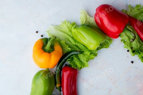 Preview: top view of pepper and lettuce on white background with copy space