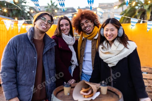 Preview: Portrait of young group millennial people enjoying time together on winter.